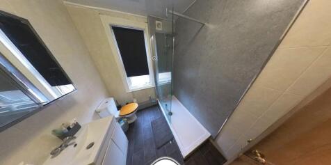 A clean and well-maintained bathroom with adequ...