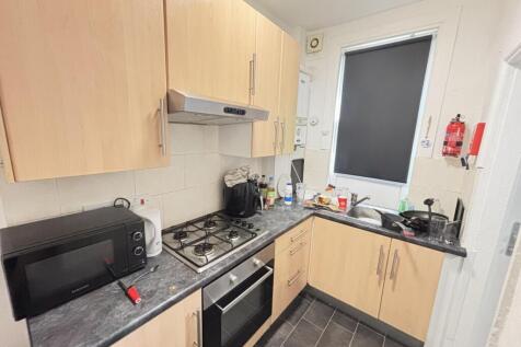 A modern, well-maintained kitchen with wooden c...