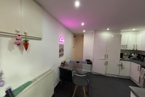 A modern and cozy living room featuring comfort...