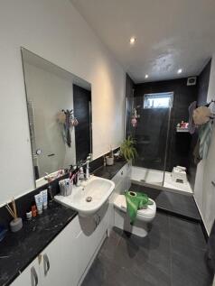 A modern, well-maintained bathroom featuring a ...