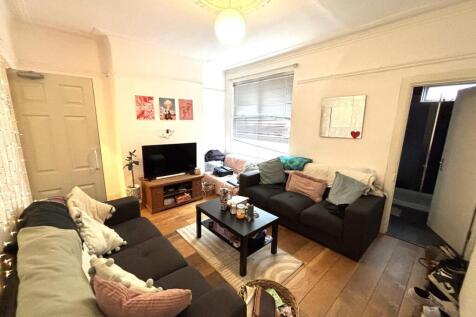 Spacious and inviting living room filled with c...