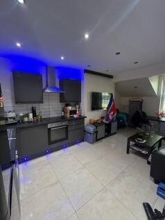 A modern, well-lit living room with contemporar...