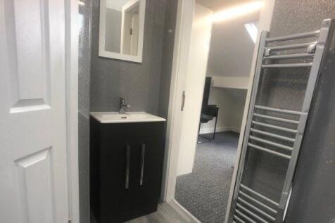 A clean and well-maintained bathroom featuring ...