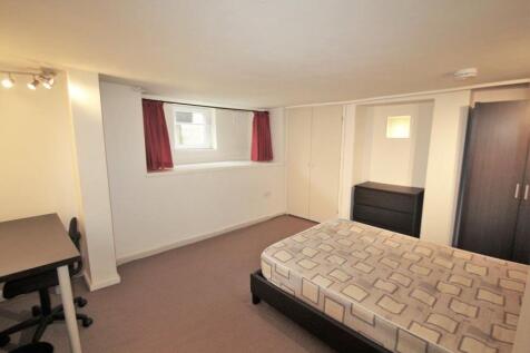 Bright and spacious master bedroom with comfort...
