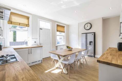 A bright and modern kitchen with ample natural ...