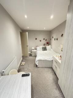 A spacious and well-maintained master bedroom f...