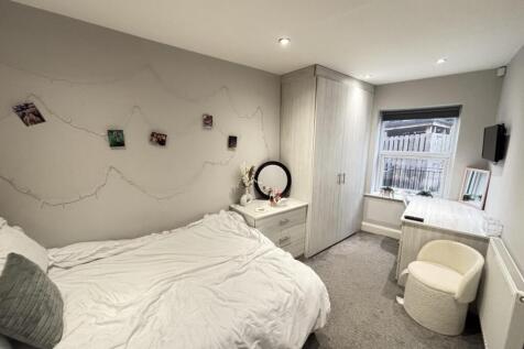 A bright and inviting double bedroom featuring ...