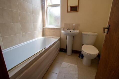 A clean, well-maintained bathroom featuring a l...