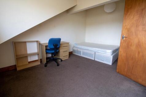 A small bathroom featuring basic fixtures, with...