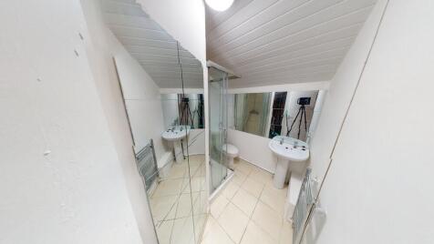 A clean and bright bathroom featuring a sink wi...