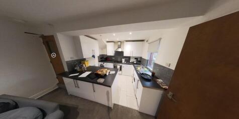 A spacious and modern living room with ample na...