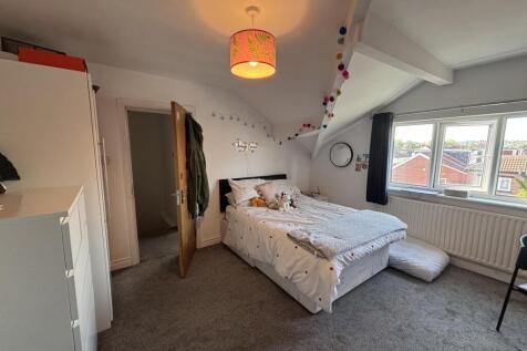 Bright and inviting double bedroom featuring a ...