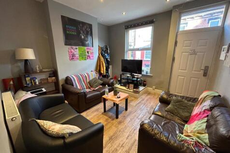 A bright and inviting living room with comforta...