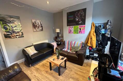 A welcoming and contemporary living room with c...