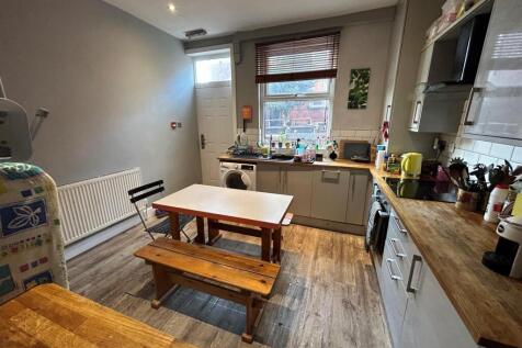 Bright and well-maintained kitchen with a cozy ...