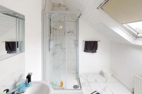 Bright and modern bathroom with a spacious show...