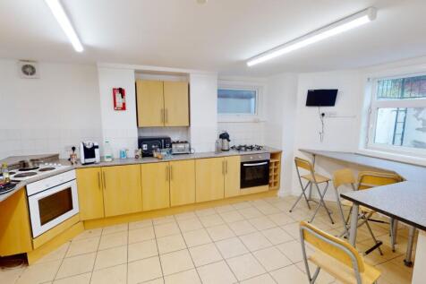 Bright and modern kitchen with ample natural li...