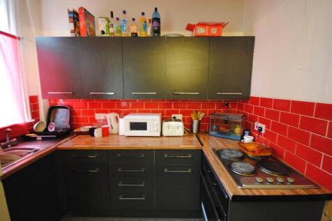 Modern kitchen with well-organized countertops,...