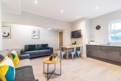 Spacious and modern living area with ample seat...