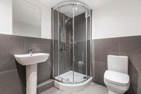 Modern and well-maintained bathroom featuring a...