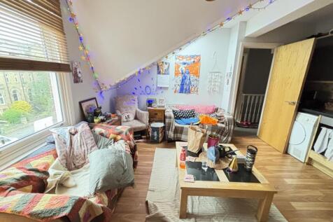 A bright and cozy living room featuring comfort...