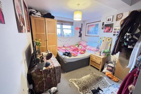 A cozy and well-decorated bedroom filled with v...