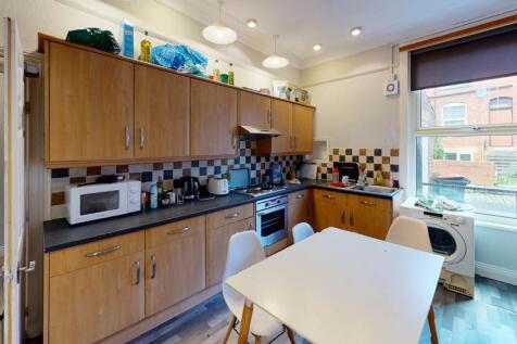 Bright and modern kitchen with ample natural li...