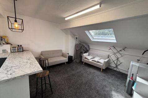 Bright and contemporary living room with a neut...