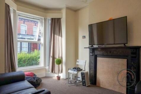 A bright and modern living room with a large wi...