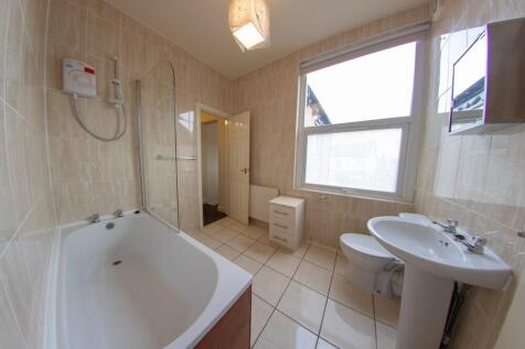 Bright and spacious bathroom featuring a large ...