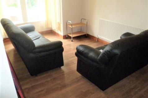 A cozy living room featuring two comfortable bl...