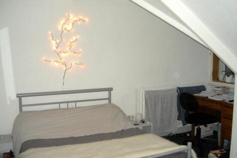 A spacious and inviting master bedroom featurin...