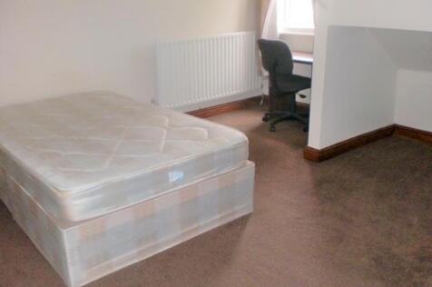 A tidy bedroom featuring a new double bed, with...