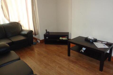 A comfortable living room featuring two sofas, ...