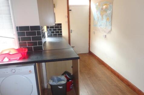 A compact, well-maintained kitchen area with es...