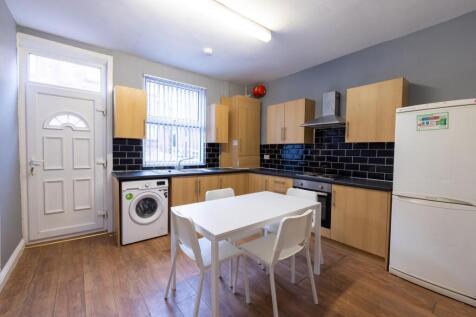 Bright, modern shared kitchen with fitted units...