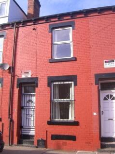 Red-brick terraced house with a neat street-fac...