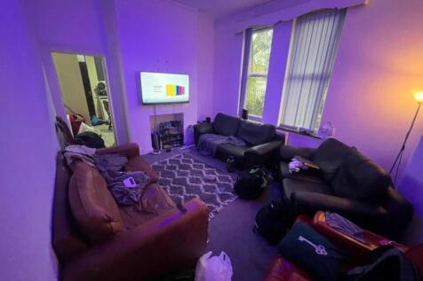 A cozy and inviting living room featuring comfo...