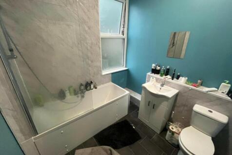 A clean and well-maintained bathroom featuring ...