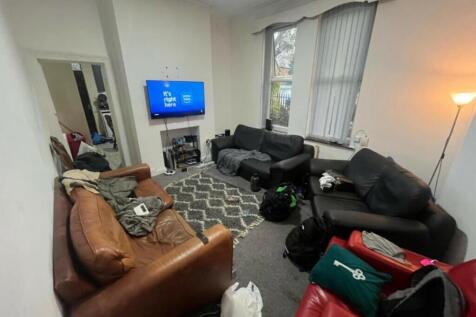 A comfortable, well-lit living room with ample ...