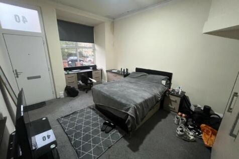 A comfortable bedroom featuring a double bed, a...