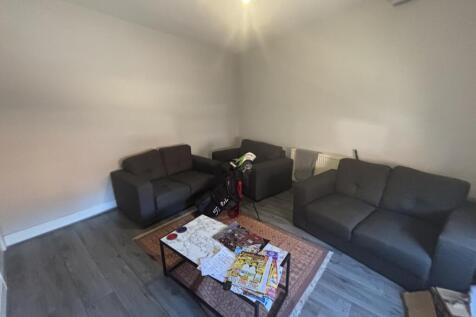 A spacious and well-maintained living room feat...