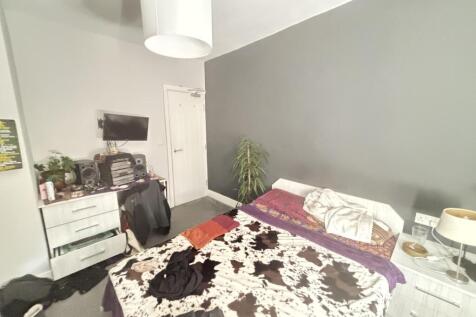 A well-maintained bedroom featuring a double be...