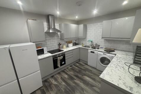 Modern and spacious kitchen with bright lightin...