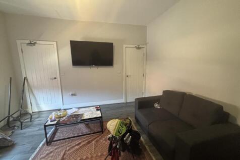 A bright, welcoming living room featuring a com...