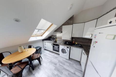 Modern kitchen space with ample natural light, ...