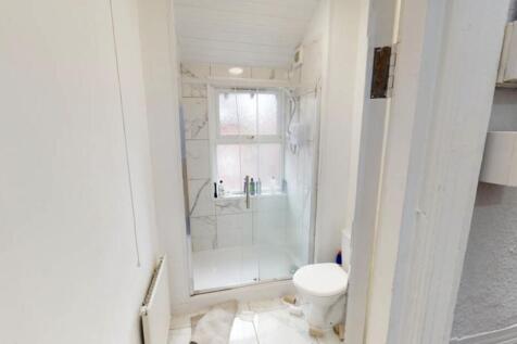 A clean and well-maintained bathroom with a bat...