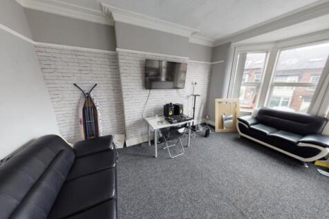 A bright and modern living room with large wind...