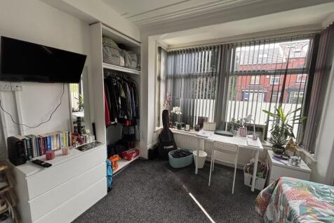 Bright and welcoming living room with large win...