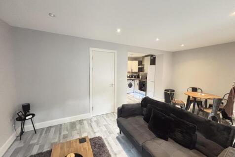 A bright and spacious living room with modern d...